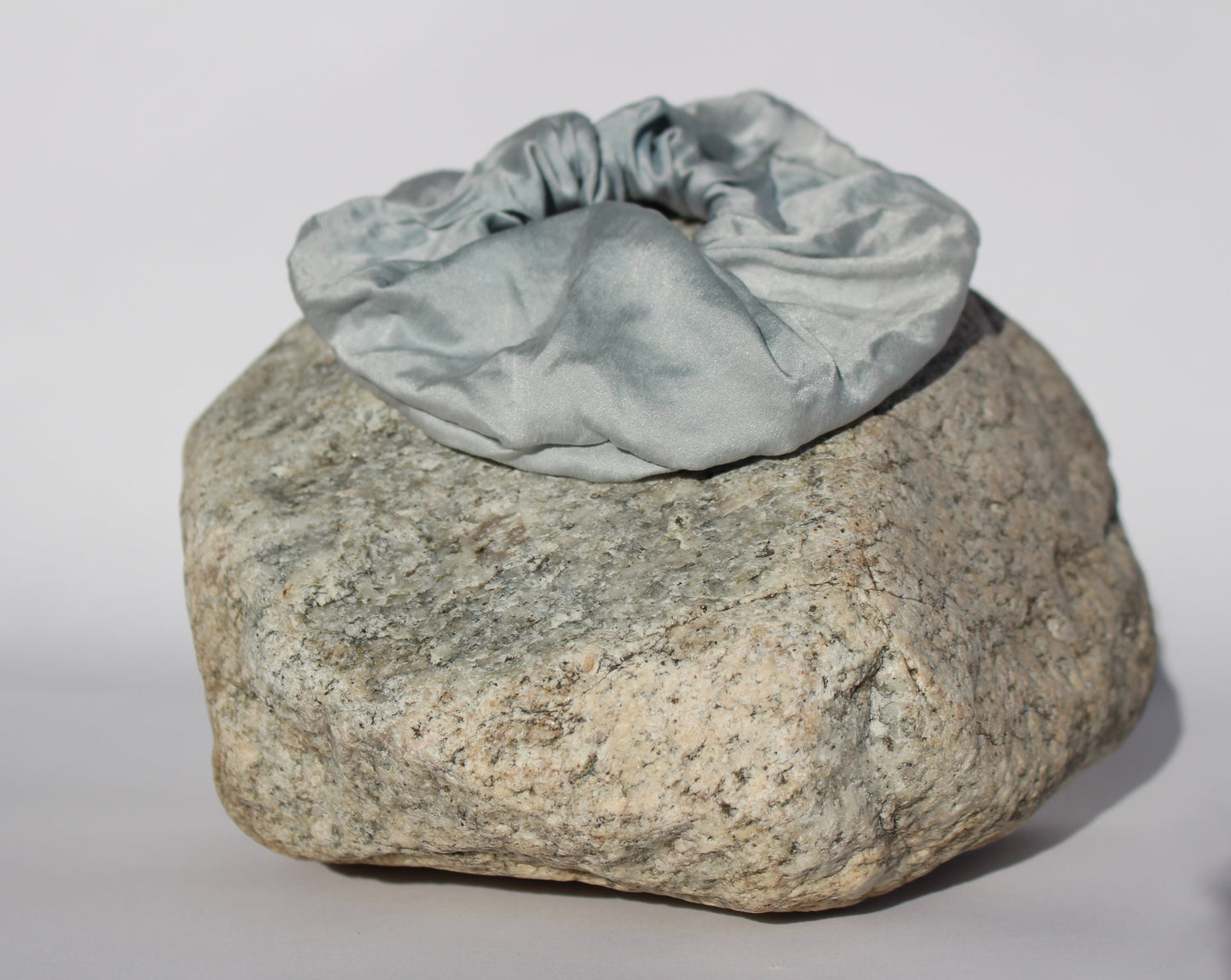 Blue silk scrunchie on a rock