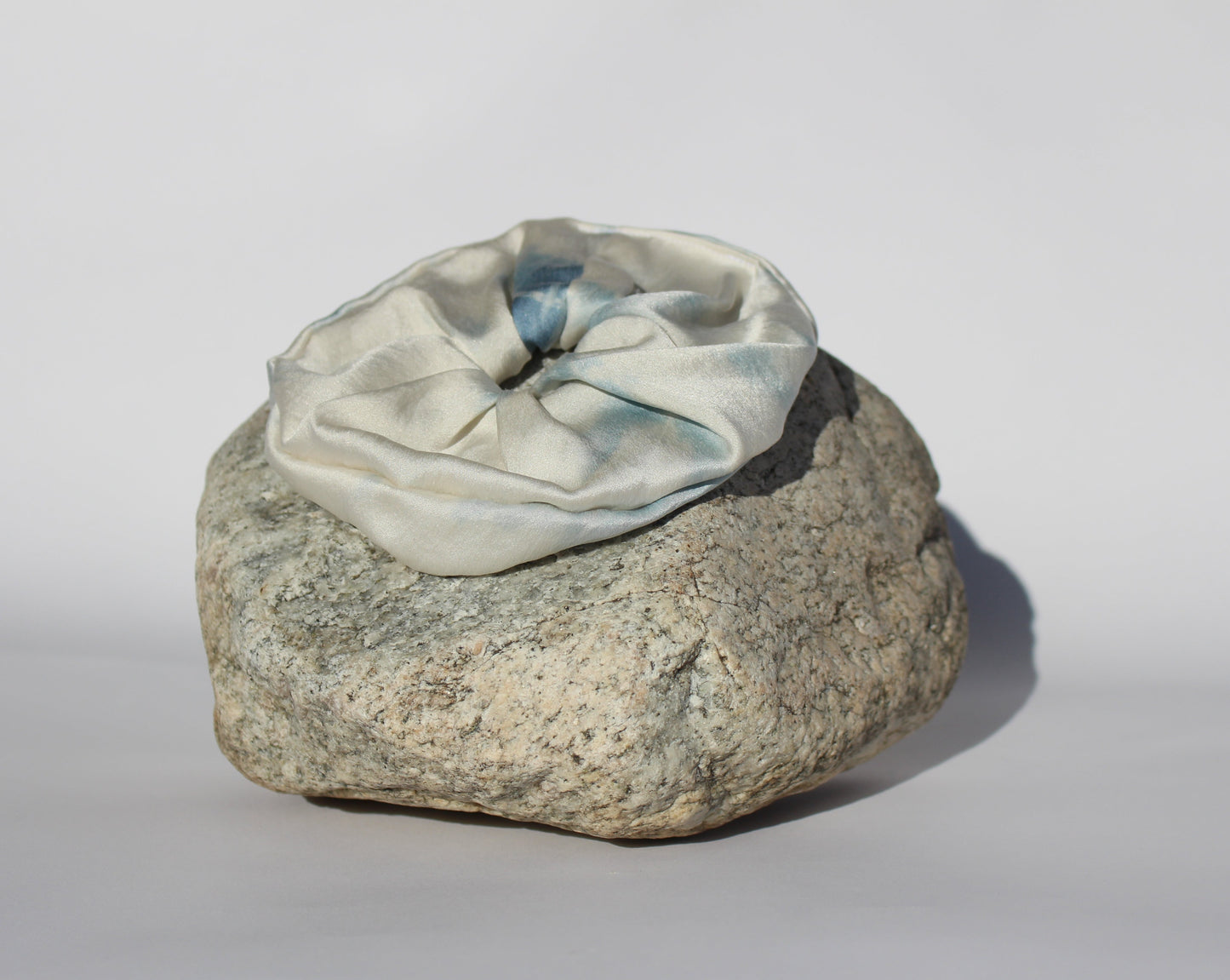 Blue silk scrunchie on a rock