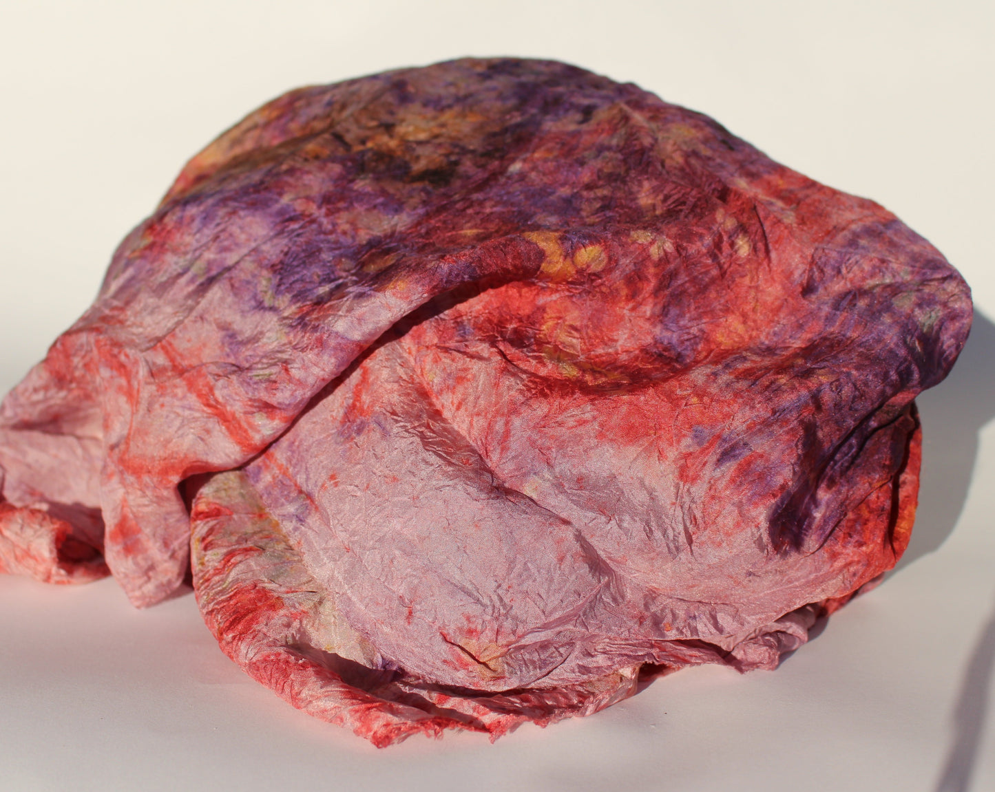 Purple and pink colored textile