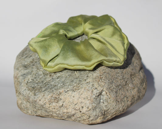 Green silk scrunchie on a rock