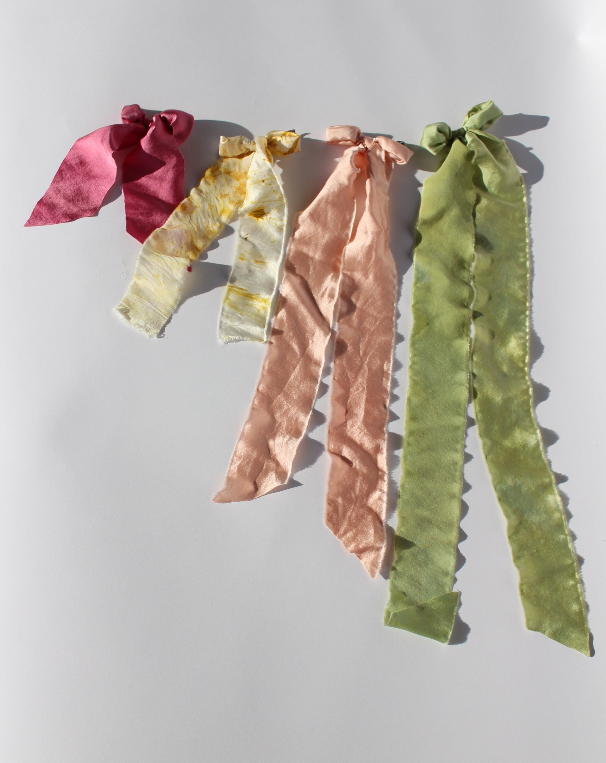 Pink, yellow, light pink, and green silk bows