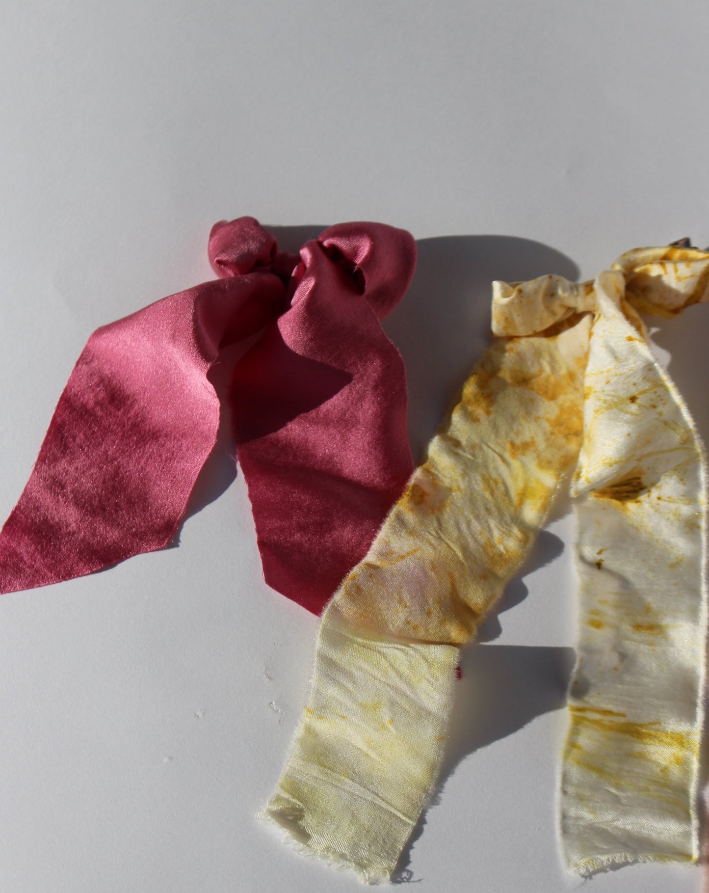 A yellow and pink silk bow 